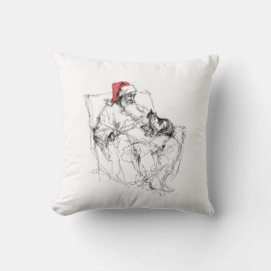 Kerstman zit met kat op schoot kussen
