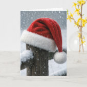 Kerstmannenhoed op een besneeuwde omheiningspaal kaart (Gele Bloem)