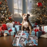 Kerstmis Blauwe en Witte Pitbull Pups Cadeaupapier<br><div class="desc">Blue & White Pitbull terrier puppy met een kleine kerstmuts op zijn grote losse hoofd, en een met een rood lint op zijn nek, allemaal op een lichtblauwe achtergrond, met geschenken en sneeuwvlokken.. grootste papier om uw geschenken in dit jaar te wikkelen, een must have voor pitbull families of eventuele...</div>