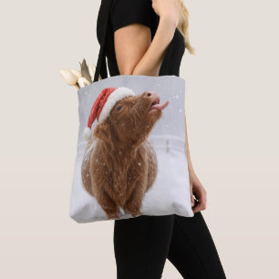 Kerstmis Hooglandkoe vangt sneeuwvlokken Tote Bag