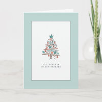Kerstmis met drijfhout boom familie aan het strand