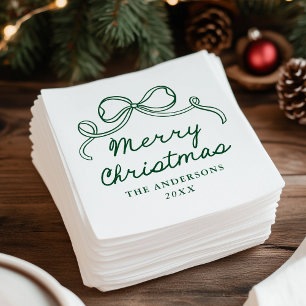Kerstmis met een groene strik in fantasievolle han servet