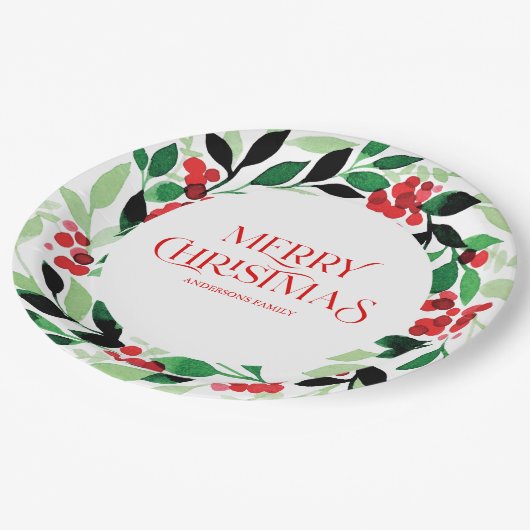 Kerstmis met groene bladeren en rode bessen papieren bordje (Gekanteld)