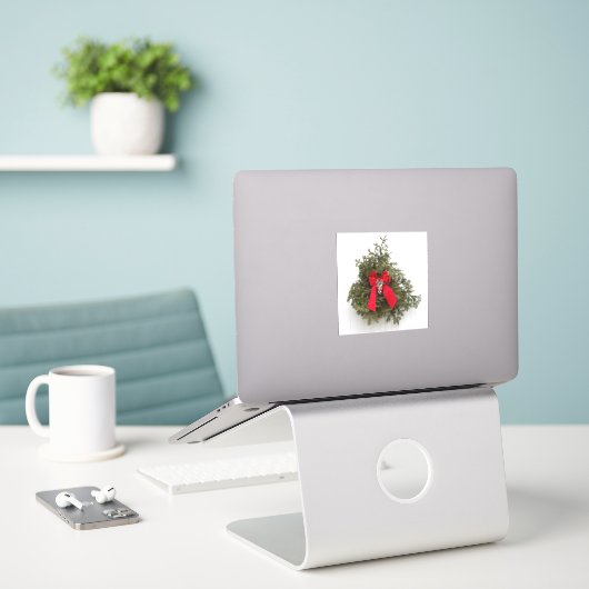 Kerstmis met rode boe sticker (Laptop op bureau)