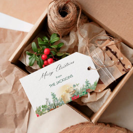 Kerstmis met vintage waterverfkaars en groen cadeaulabel