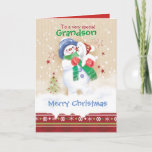 Kerstmis, oma. Cute Snowman en Puppy Feestdagen Kaart<br><div class="desc">Een mooie kerstkaart voor een jonge kleinzoon. Het heeft een schattig sneeuwkind dat een schattige sneeuwpop omhelst. Hij draagt een blauw pet, een groene sjaal en rode handschoenen terwijl zijn puppy een kersthoed draagt. De sneeuw valt om hen heen en een decoratieve kerstgrens loopt de onderkant van de kaart af...</div>