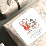Kerstmis Sticker met Gezellige Kerstman<br><div class="desc">Voeg een charmante finishing touch toe aan kerstcadeaus en seizoensgebonden verpakkingen met deze gezellige kerstmis sticker met speelse Kerstman,  sneeuwman en rendier illustraties. Ontworpen met een minimalistische hygge-geïnspireerde esthetiek,  is deze feestelijke sticker perfect voor cadeauverpakking,  kerstpost,  kerstverpakkingen,  feestelijke favorieten en winterstationery.</div>