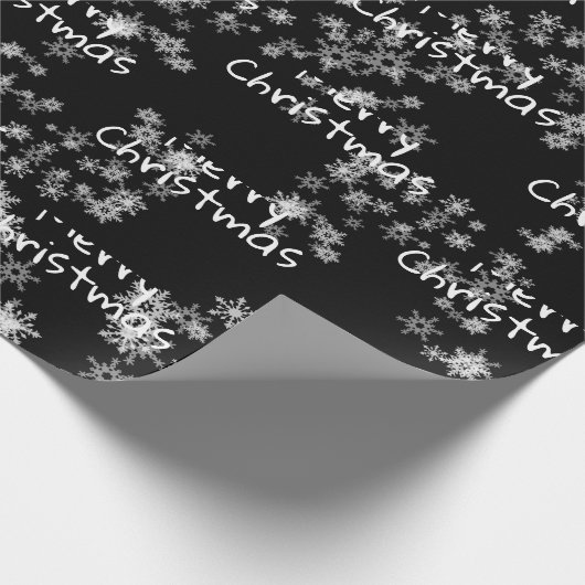 Kerstmis tekst in sneeuwvlokken   cadeaupapier (Hoek)