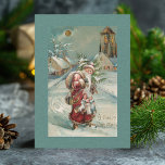 Kerstmis ter wereld in sneeuw Feestdagenkaart<br><div class="desc">Kerstmis met een roodbed die door de sneeuw loopt met zijn armen gevuld met speelgoed. De rug kenmerkt douane leeg etiket en editable tekstgebieden.</div>