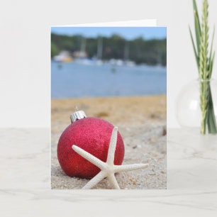 Kerstornament en zeesterzand kaart