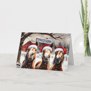 Kerstpaarden in de sneeuw met leuke kerstmannenhoe kaart
