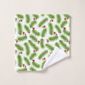 Kerstpijnboombladeren en bessen op wit bad handdoek (Wasdoekje)