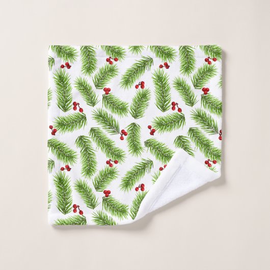Kerstpijnboombladeren en bessen op wit bad handdoek (Wasdoekje)