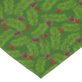 Kerstpijnboombladeren, kegels & bessen op groen tafelkleed (Gekanteld)