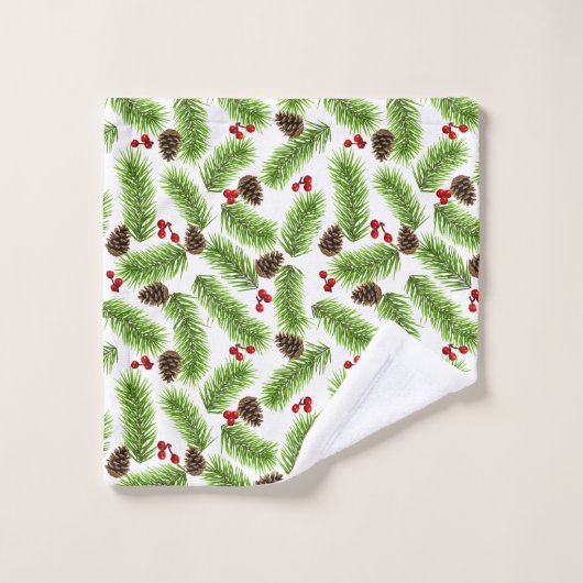 Kerstpijnboombladeren, kegels en bessen op wit bad handdoek (Wasdoekje)