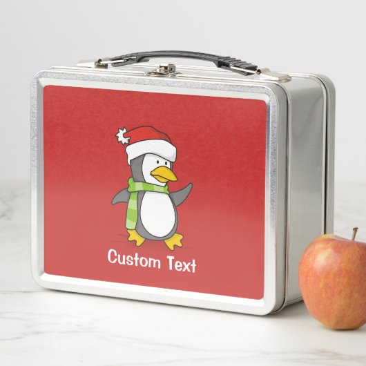 Kerstpinguïn loopt op sneeuw (In situ)