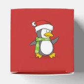 Kerstpinguïn loopt op sneeuw bedankdoosjes (Bovenkant)