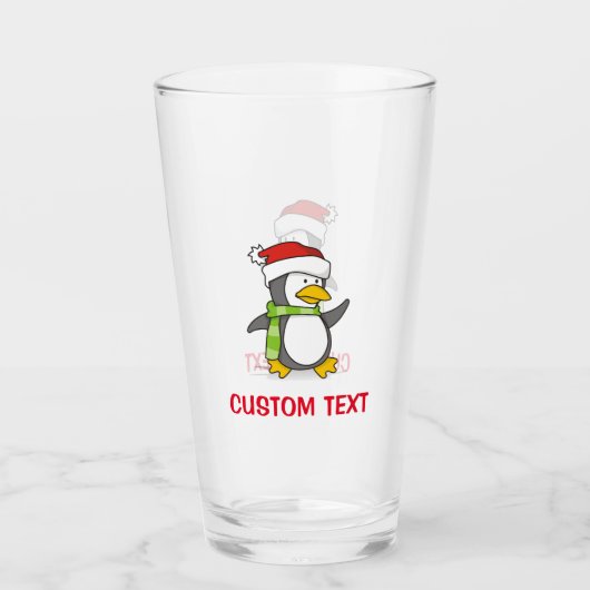 Kerstpinguïn loopt op sneeuw glas (Voorkant)