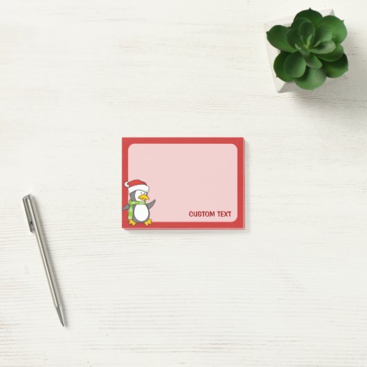 Kerstpinguïn loopt op sneeuw post-it® notes (Kantoor)