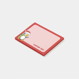 Kerstpinguïn loopt op sneeuw post-it® notes