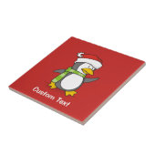 Kerstpinguïn loopt op sneeuw tegeltje (Zijkant)