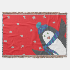 Kerstpinguïn op rood deken