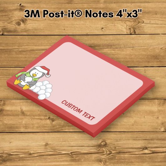 Kerstpinguïn zittend met sneeuwballen post-it® notes