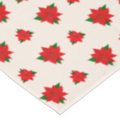 kerstpoinsettia bloemen op lichtbeige tafelkleed (Gekanteld)