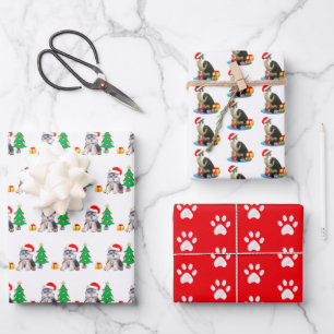 Kerstpuppyhond, kerstliedjeskat & poten op rood inpakpapier vel