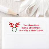 Kerstrendierantaarns geven adreslabels terug etiket (Insitu)