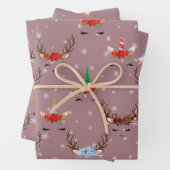 Kerstrendieren en eenhoornaars op roze inpakpapier vel (In situ)