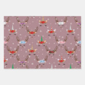 Kerstrendieren en eenhoornaars op roze inpakpapier vel (Voorkant)