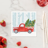 Kerstroodbedekking vrachtwagen op een sneeuwweg servet (Insitu)