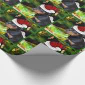 Kerstrottweiler, papier voor het verpakken van pup (Hoek)