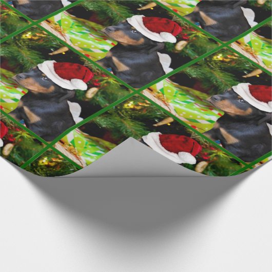 Kerstrottweiler, papier voor het verpakken van pup (Hoek)