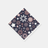 Kerstroze goudmetaalsneeuwvlokken in blauw servet (Hoek)