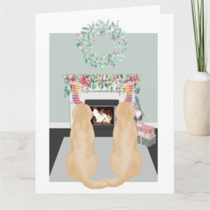 Kerstscene met twee gele labradorhonden bij de ope kaart