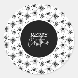 Kerstscript met zwarte sneeuwvlokken ronde sticker