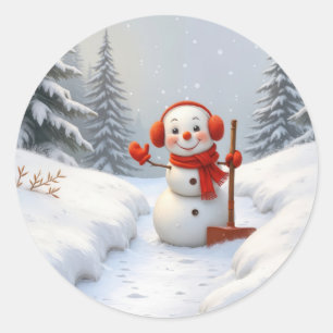 Kerstsneeuwman met een rode sneeuwschoffel ronde sticker
