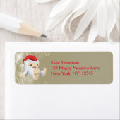 Kerstsneeuwpop met een rode kersthat etiket (Insitu)