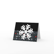 Kerstsneeuwvlokken en -bladeren met zwarte rug