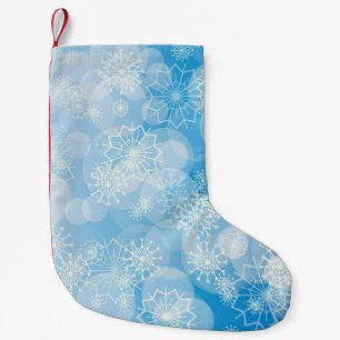 Kerstsneeuwvlokken op een blauwe achtergrond kleine kerstsok