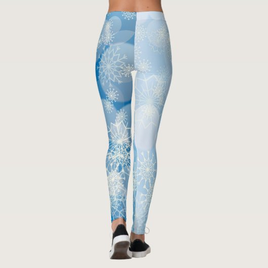 Kerstsneeuwvlokken op een blauwe achtergrond leggings (Achterkant)