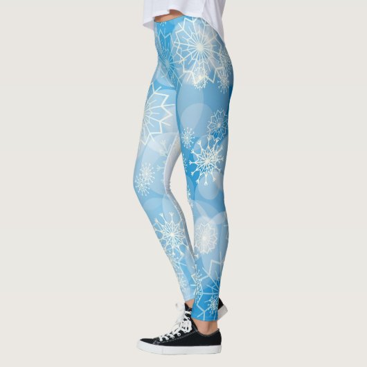 Kerstsneeuwvlokken op een blauwe achtergrond leggings (Links)