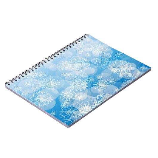 Kerstsneeuwvlokken op een blauwe achtergrond notitieboek (Linkerzijde)