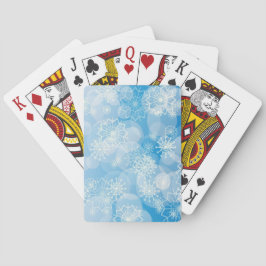 Kerstsneeuwvlokken op een blauwe achtergrond pokerkaarten