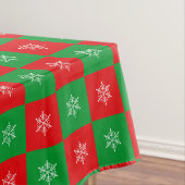 kerstsnowflakes op rode en groene tablet tafelkleed (Voorbeeld)