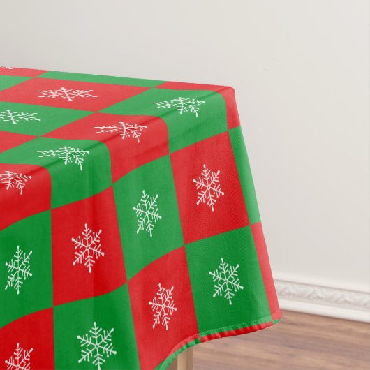 kerstsnowflakes op rode en groene tablet tafelkleed (Voorbeeld)