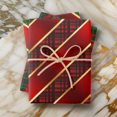 Kerstspelden en koolstof-groene en rode variëteit inpakpapier vel