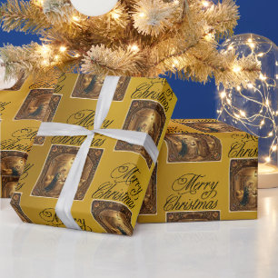 Kerststal op goudkleurig cadeaupapier
